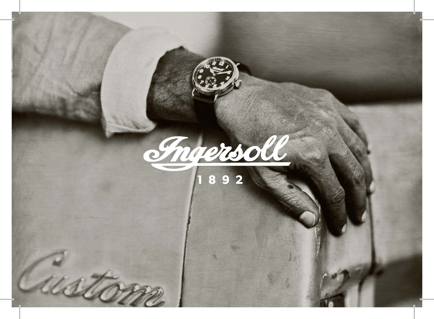 Person wearing an Ingersoll watch on a suitcase with 'Ingersoll 1892' branding.