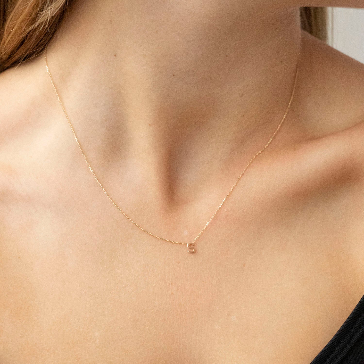 Adjustable initial necklace clearance